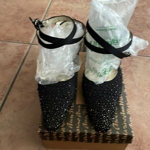 Beaded heels that wraps around ankle to close.